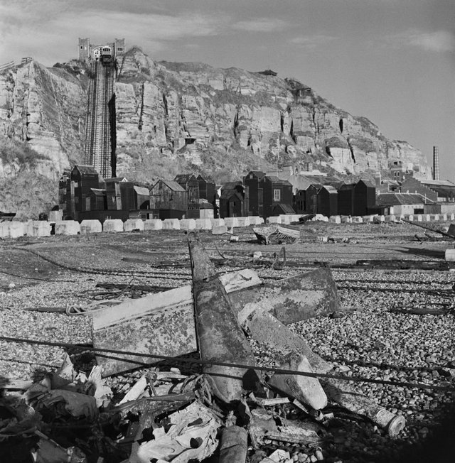 1945_november_the_wreckage_of_a_crashed_v-1_flying_bomb_lies_part_buried_with_other_debris_from_world_war_ii_on_the_shingle_beach_at_hastings_in_sussex_england.jpg