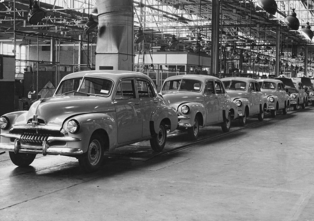 1954_holden_fj_standard_sedan_motor_cars_coming_off_the_production_line_of_the_general_motors-holden_production_facility_in_melbourne_victoria_australia.jpg