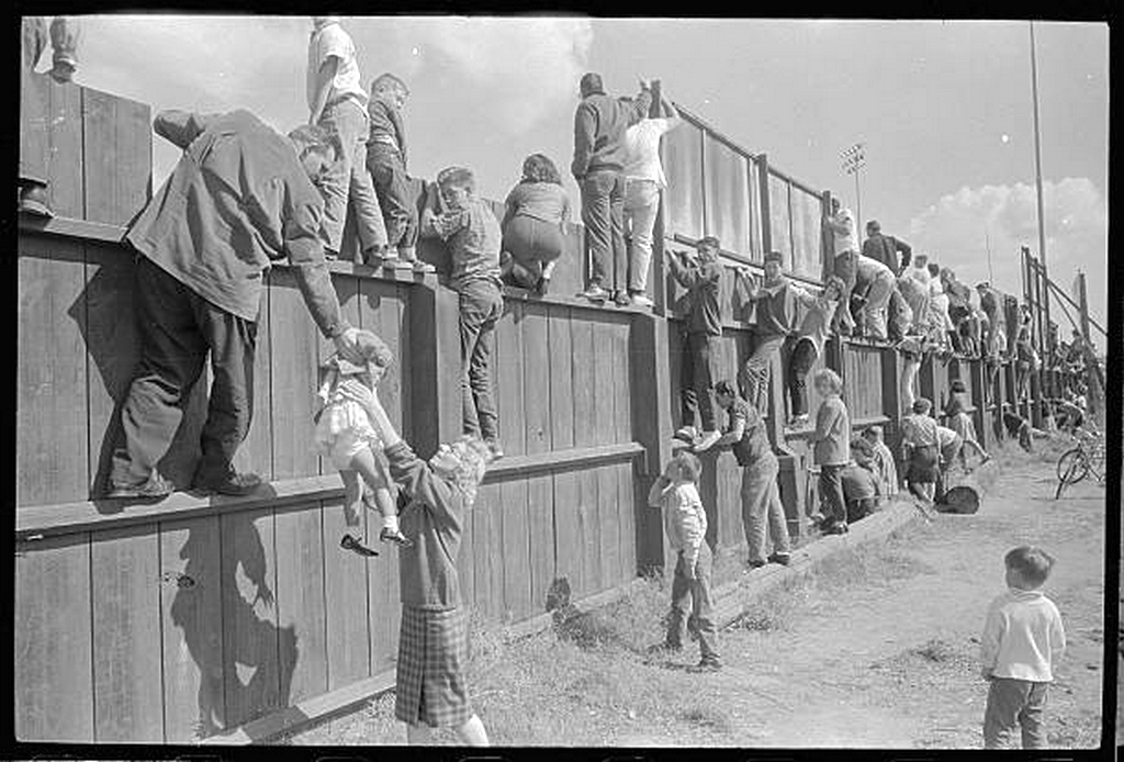 1962_fans_climb_the_fence_to_view_the_world_series_at_candlestick_park_in_san_francisco_california.png