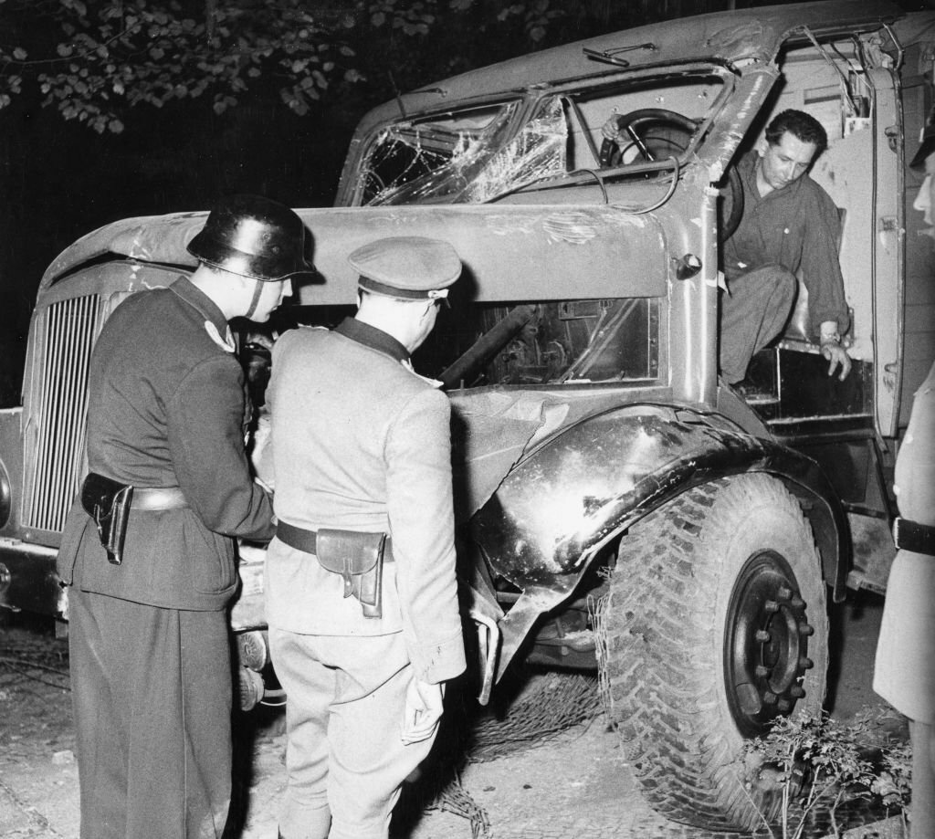 1961_east_german_police_inspect_the_wreckage_of_a_truck_used_to_ram_the_berlin_wall_berlin_east_germany.jpg