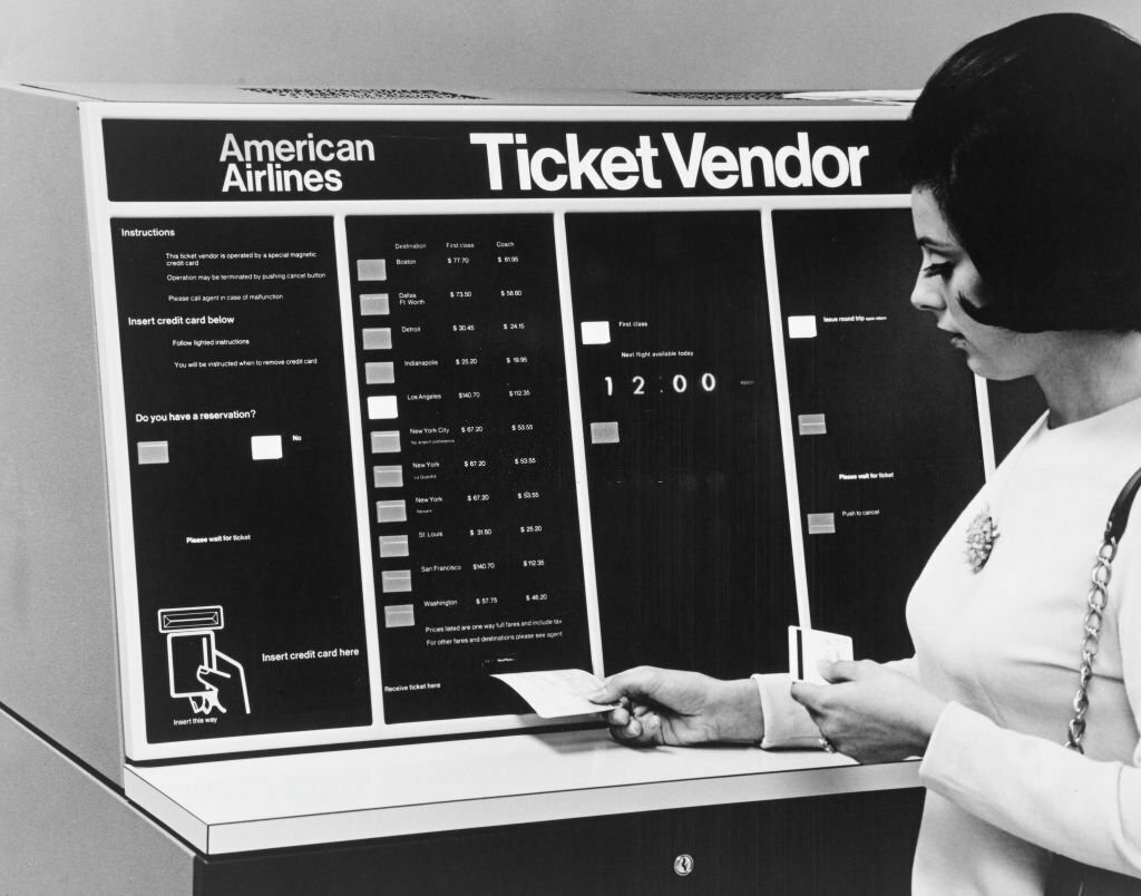 1970_a_woman_uses_an_american_airlines_ticket_vendor_machine_the_world_s_first_self-service_airline_ticket_vending_kiosk.jpg