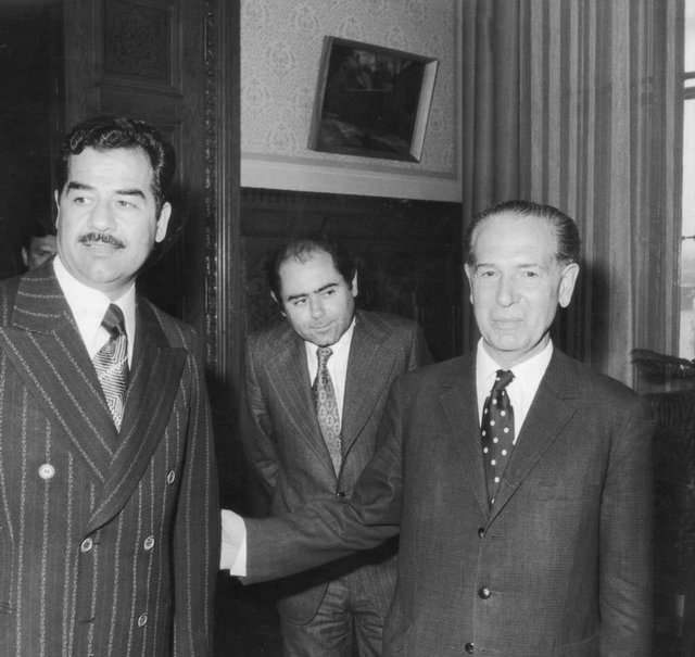 1975_iraqi_leader_saddam_hussein_left_is_received_by_hungarian_premier_jeno_fock_right_on_an_official_visit_to_budapest.jpg