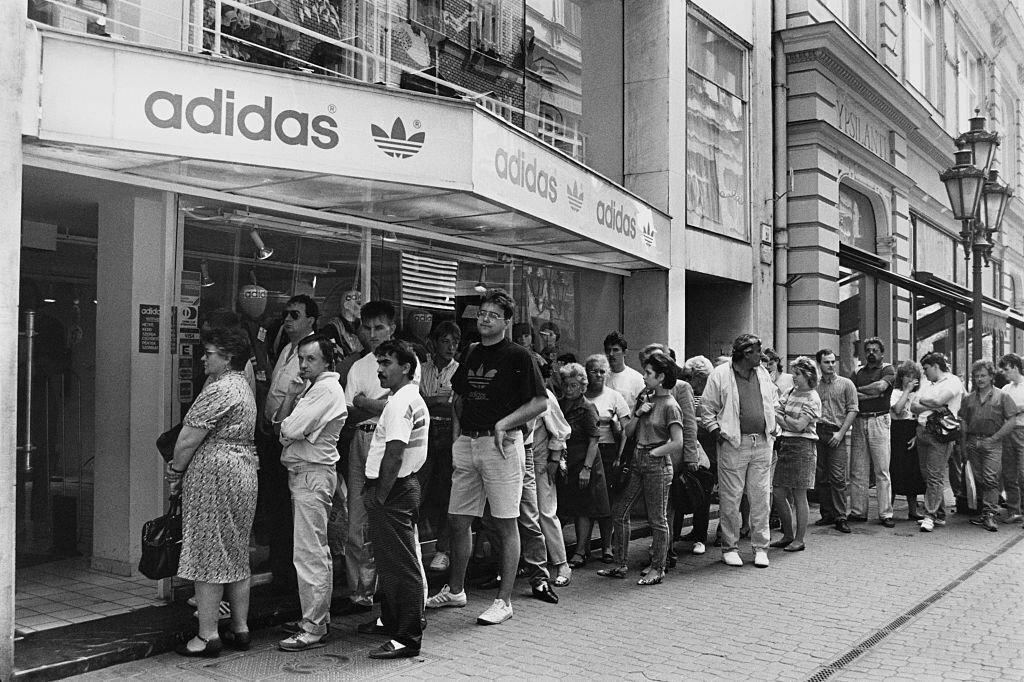 1990_people_queuing_outside_a_shop_selling_adidas_on_vaci_utca_in_budapest_hungary.jpg