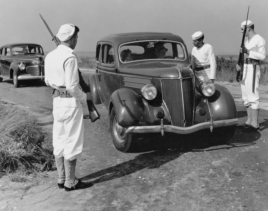 1942_armed_members_of_the_coast_guard_ask_for_identification_from_this_drive_on_one_other_roads_on_long_island_s_south_shore_after_the_alarm_was_given_that_a_spy_might_have_landed_from_a_raft.jpg