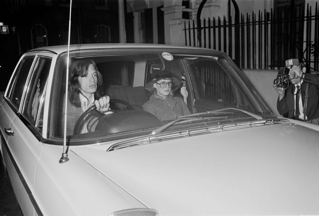 1978_mick_jagger_of_the_rolling_stones_drives_marianne_faithfull_from_a_police_station_back_to_his_chelsea_flat_after_the_pair_were_granted_bail_on_charges_of_cannabis_possession_london.jpg