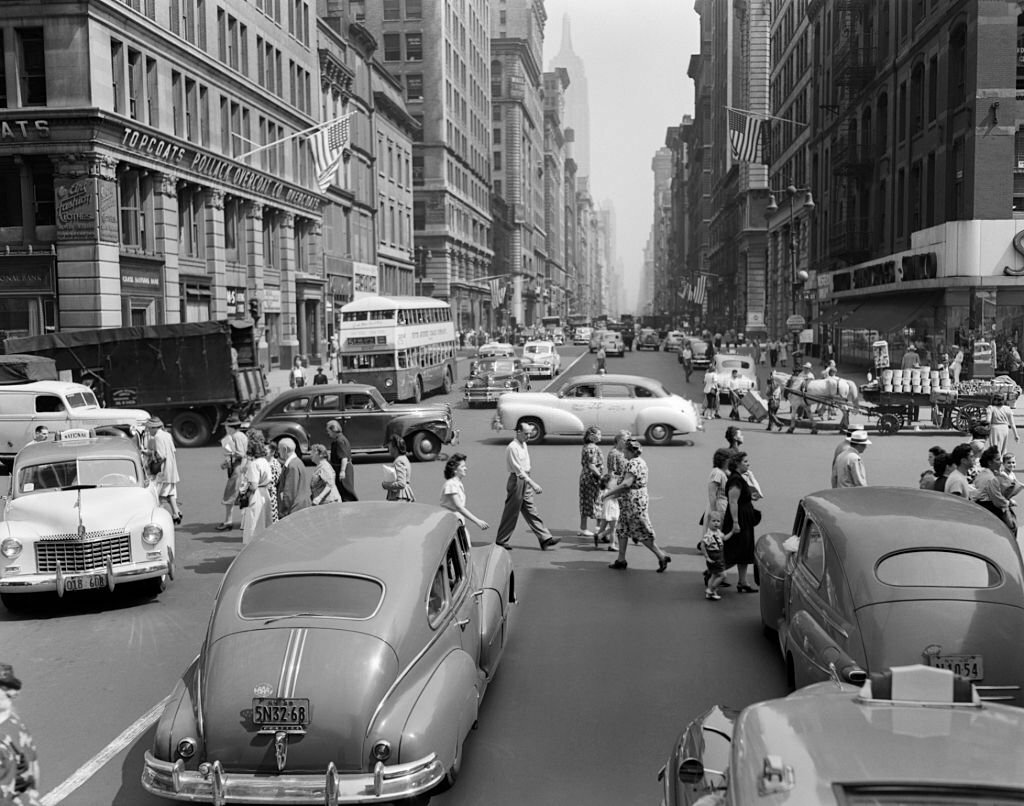 1950s_street_scene_crowds_traffic_intersection_fifth_avenue_14_street_manhattan_ny_new_york_city.jpg