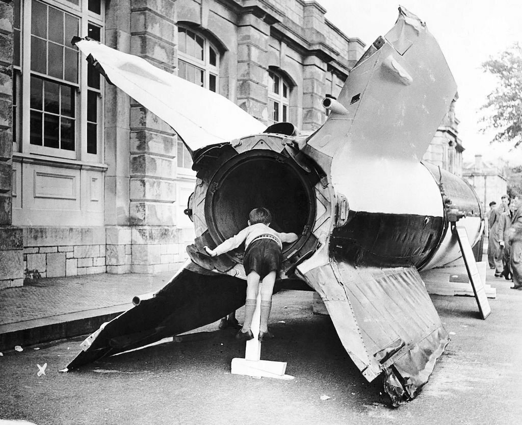 1945_a_young_boy_with_a_captured_v2_flying_bomb_during_an_open_day_at_devonport_docks.jpg
