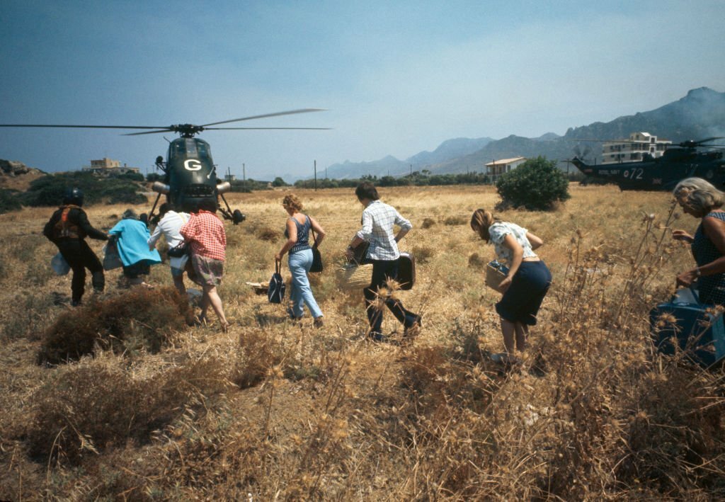 1974_british_holidaymakers_being_evacuated_by_a_royal_navy_wessex_helicopter_from_hms_hermes_near_kyrenia_after_the_turkish_invasion_of_cyprus.jpg