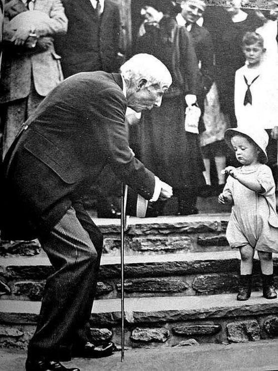 1929_john_d_rockefeller_gifting_a_5_cent_coin_to_a_child_on_his_84th_birthday.jpeg