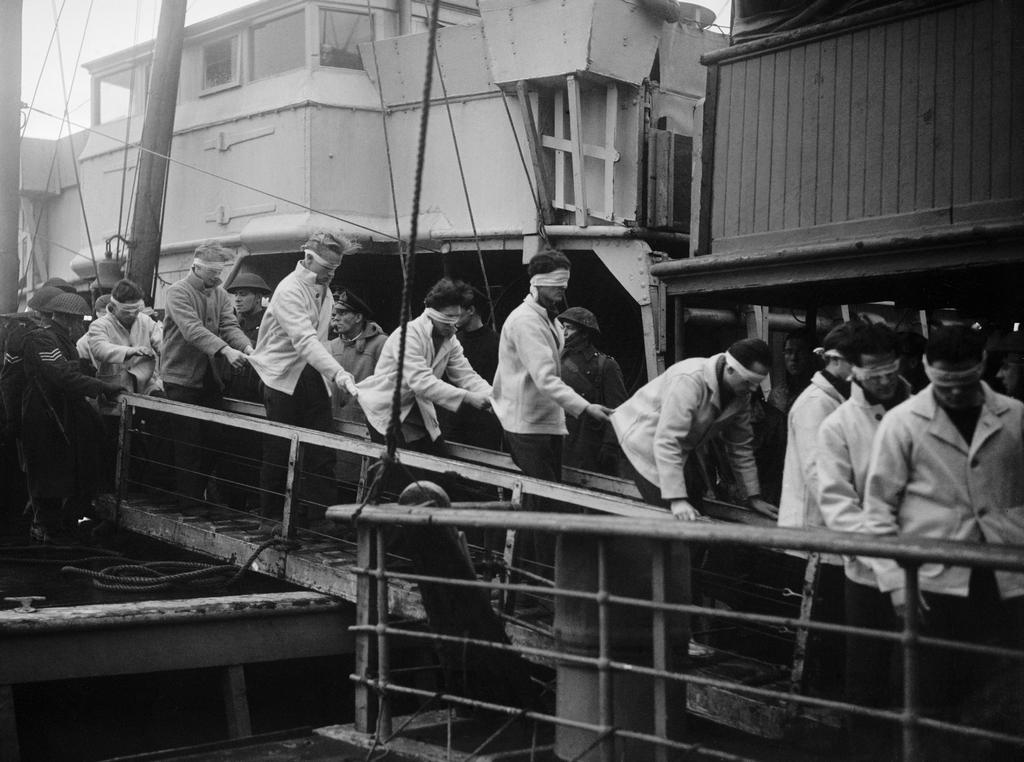 1944_captured_german_sailors_rescued_from_the_sunken_battleship_scharnhorst_after_the_battle_of_the_north_cape_disembark_ss_st_ninian_at_scapa_flow_scotland.jpeg
