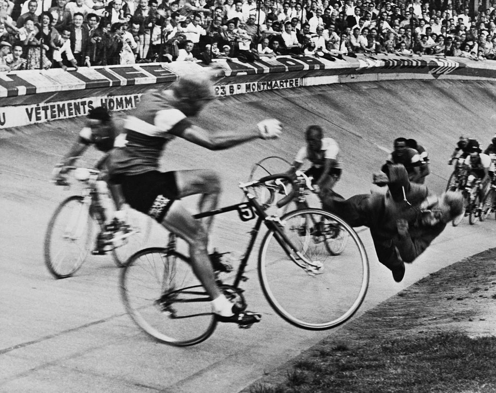 1958_tour_de_france_brussels-paris_dramatic_fall_of_the_french_rider_andre_darrigade_he_slams_into_a_track_official.jpg