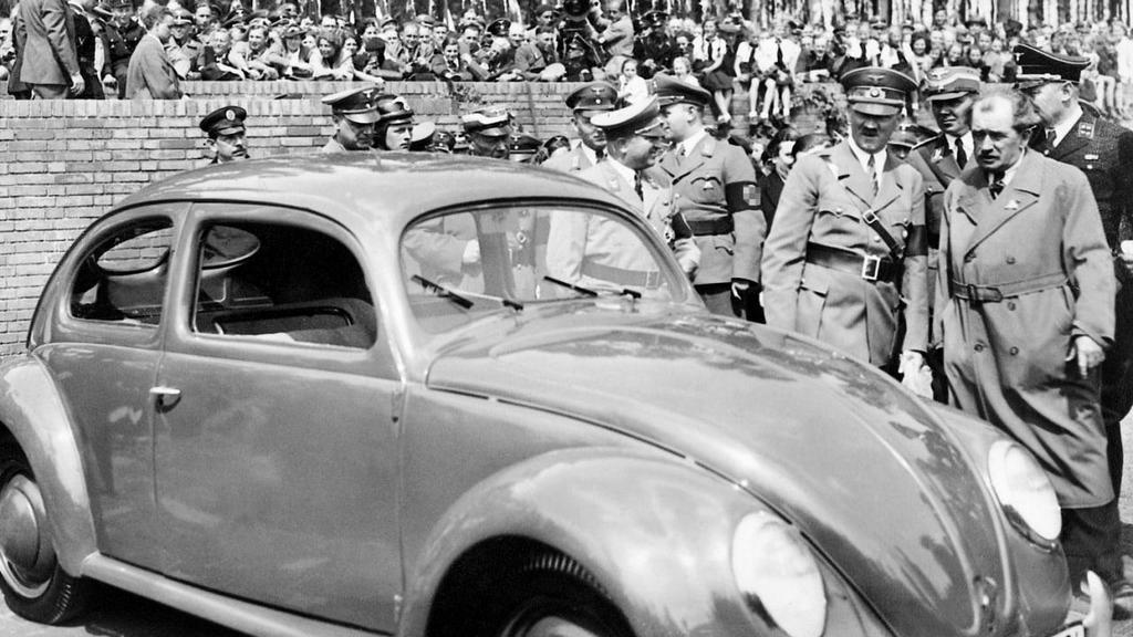 1938_adolf_hitler_and_ferdinand_porsche_during_the_ceremony_of_laying_the_foundation_stone_for_the_future_volkswagen_automobile_plant.jpeg