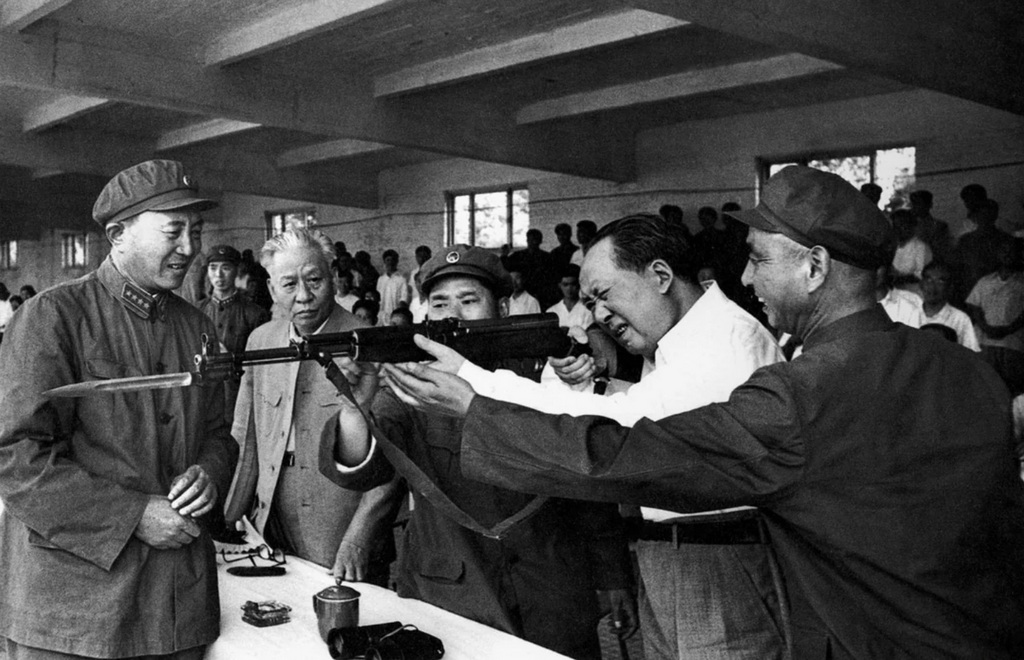 1964_chinese_communist_dictator_mao_zedong_test-firing_a_rifle_during_an_inspection_of_a_military_training_site.jpg