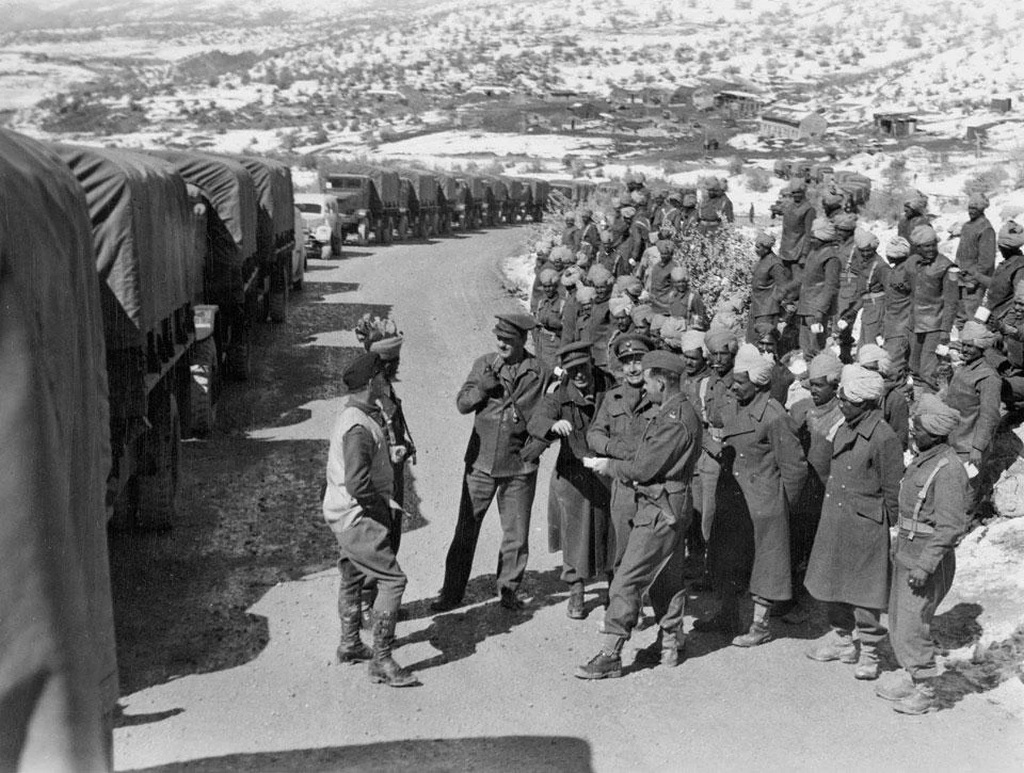 1944_british_indian_army_soldiers_stand_next_to_a_supply_convoy_en_route_through_the_persian_corridor_to_the_soviet_union.jpg