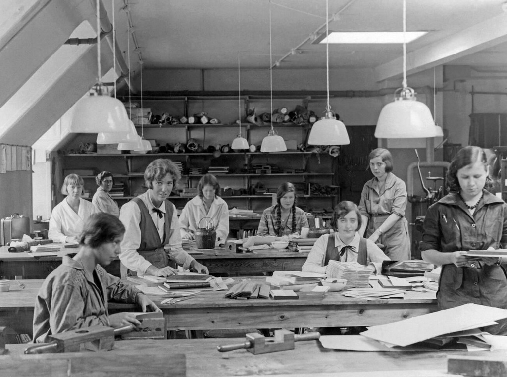 1935_two_danish_princesses_apprenticing_with_other_young_women_in_the_bookbindery_of_a_copenhagen_workshop.jpg