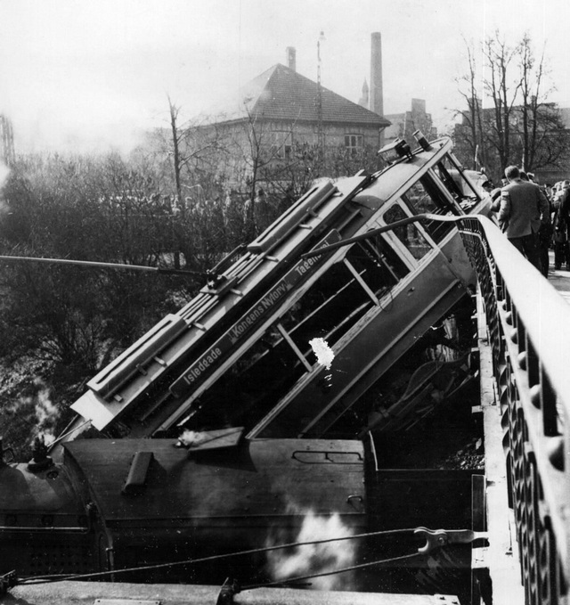 1958_a_tram_which_left_the_rails_crashed_through_a_balustrade_of_a_railway_bridge_in_copenhagen_just_before_the_hamburg_express.jpg