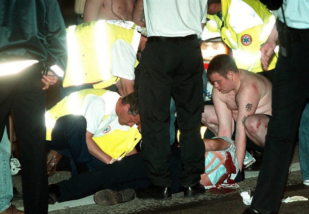 2000_arsenal_fan_is_attended_to_by_paramedics_and_friends_after_being_stabbed_in_copenhagen_during_a_night_of_violence_with_galatasaray_hooligans.jpg