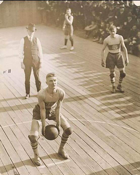 1921_atlanta_high_school_basketball_player_shooting_underhand_a_free_throw_against_tech_high_school.jpeg