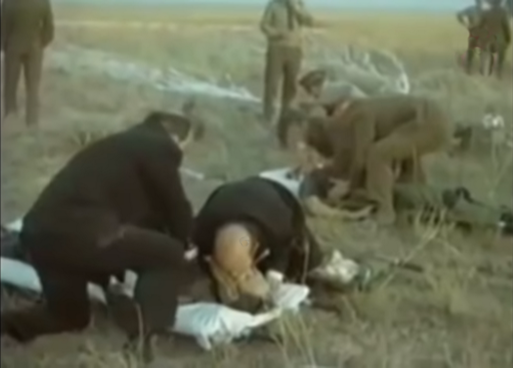 1971_ussr_officials_attempting_in_vain_to_resuscitate_the_dead_crew_of_soyuz_11_after_it_s_reentry.png
