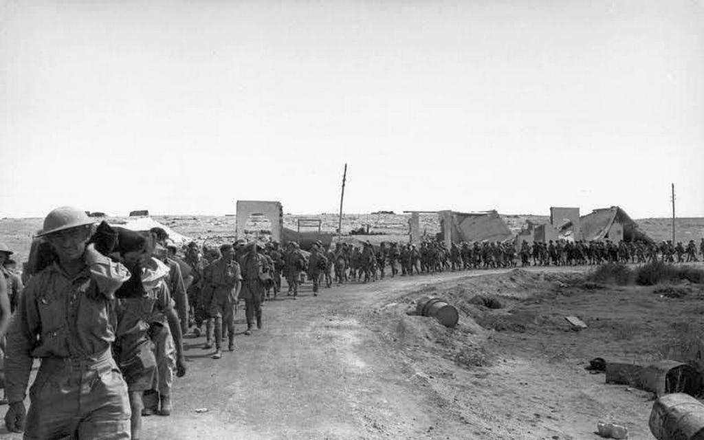 1942_british_and_commonwealth_prisoners_of_war_marched_out_of_tobruk_following_the_surrender_of_the_allied_garrison_of_33_000_personnel_to_the_german_afrikakorps.jpeg