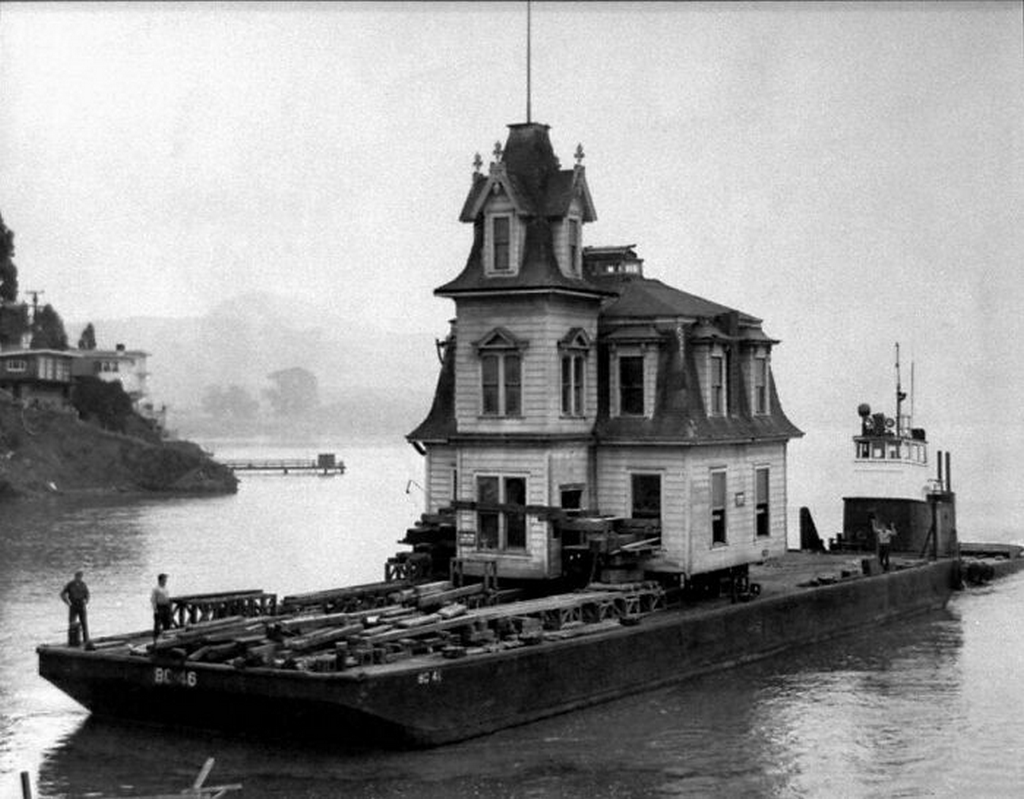 1957_victorian_home_being_moved_by_boat_in_tiburon_california.png