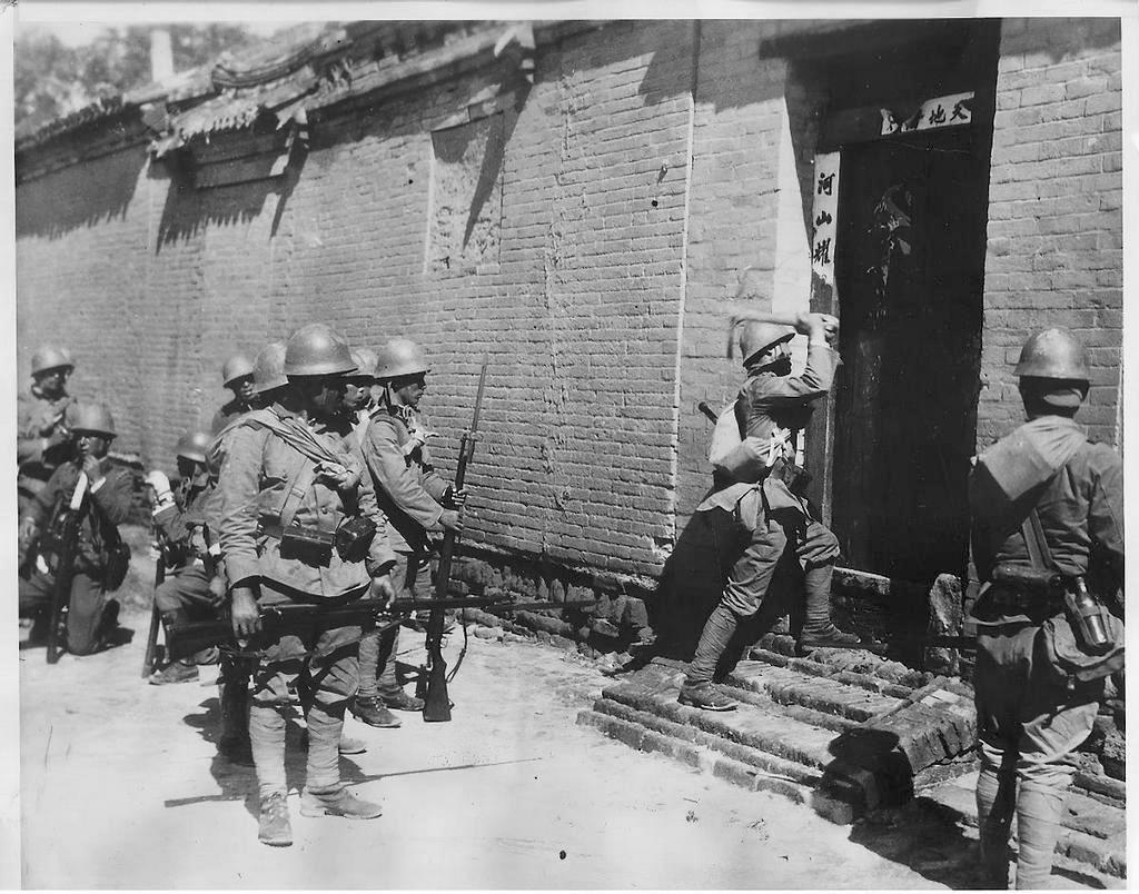 1937_japanese_troops_forcing_their_way_into_a_house_in_shanghai.jpeg