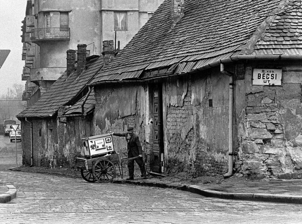 1972_a_man_with_a_cart_outside_a_dilapidated_house_in_budapest.jpg