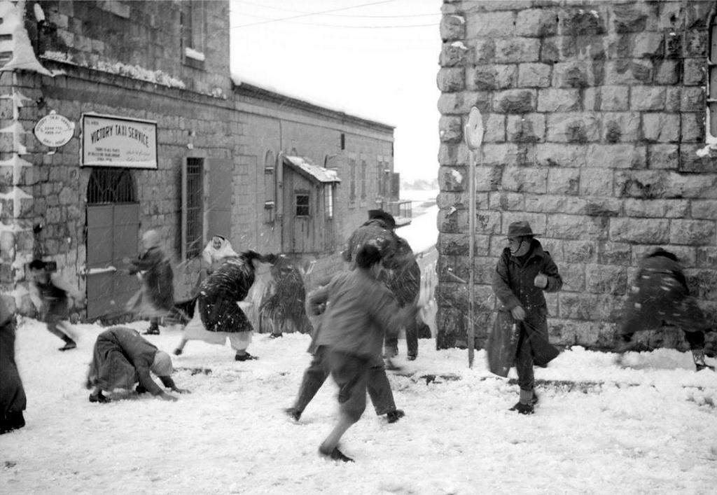 1942_palestinian_civilians_and_australian_soldiers_engage_in_a_spirited_snowball_fight_in_jerusalem.jpeg