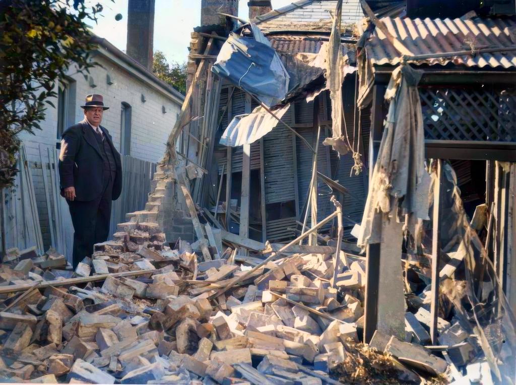 1942_a_man_inspects_from_japanese_shelling_in_bondi_sydney.jpeg