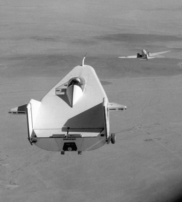 1964_the_m2-f1_lifting_body_aircraft_being_towed_behind_a_c-47_at_the_nasa_flight_research_center_edwards_air_force_base_ca.jpeg