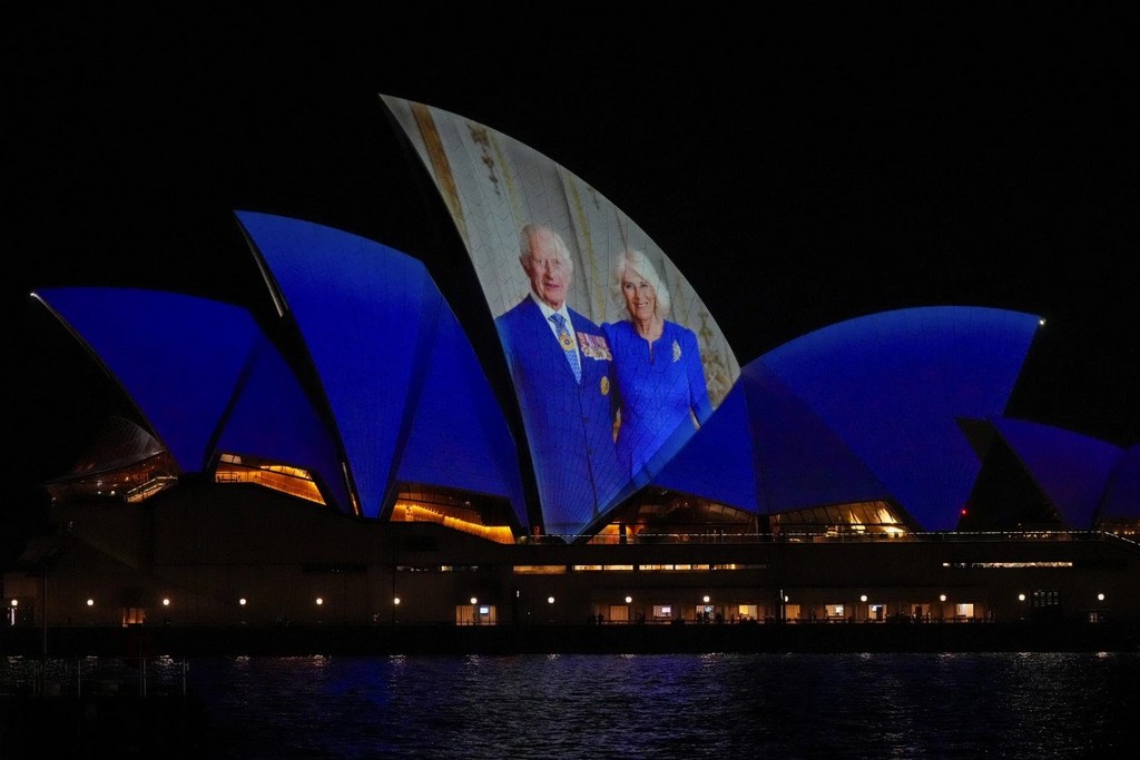 2024_10_18_the_sydney_opera_house_sails_show_photos_of_britain_s_king_charles_and_queen_camilla_soon_after_their_arrival_in_sydney_australia_ap_photo_mark_baker.jpg