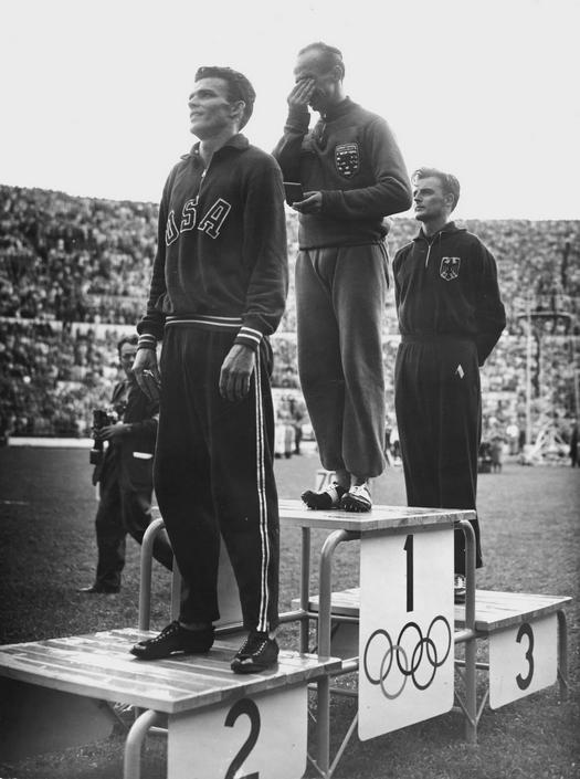 1952_luxembourg_s_josy_barthel_cries_on_the_podium_after_winning_the_1500m_race_at_the_helsinki_olympics.jpeg