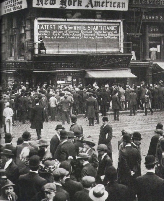 1912_a_young_man_writes_the_titanic_disaster_announcement_in_times_square_new_york.jpeg
