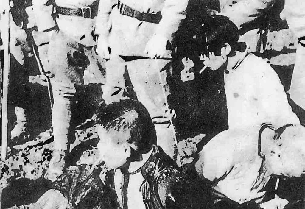 1938_the_last_smoke_of_a_young_man_who_is_buried_alive_by_japanese_soldiers_in_nanjing_china.jpeg