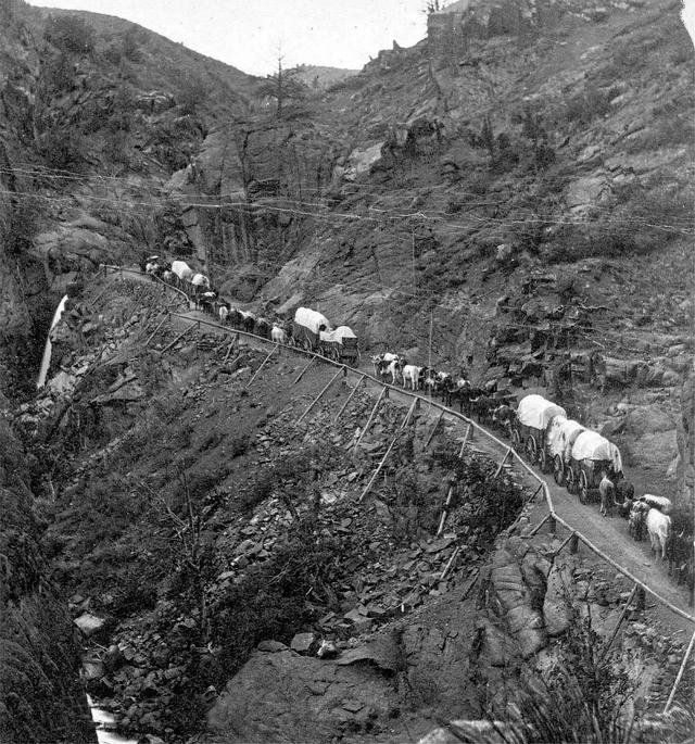1878_heavy_traffic_in_the_old_west_freight_wagons_ascend_ute_pass_in_colorado.jpeg