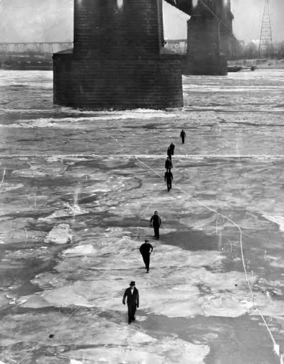 1936_people_walking_across_the_frozen_mississippi_river_in_st_louis.jpeg