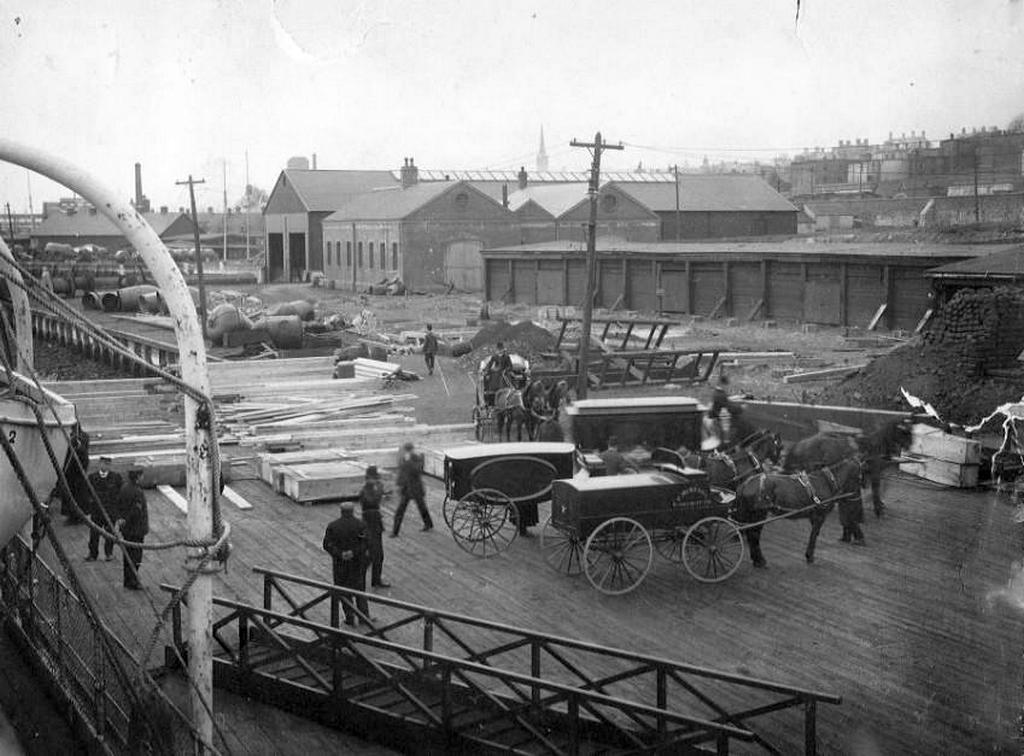 1912_hearses_lined_up_on_halifax_wharf_transferring_rms_titanic_victims_recovered_by_cs_minia.jpeg