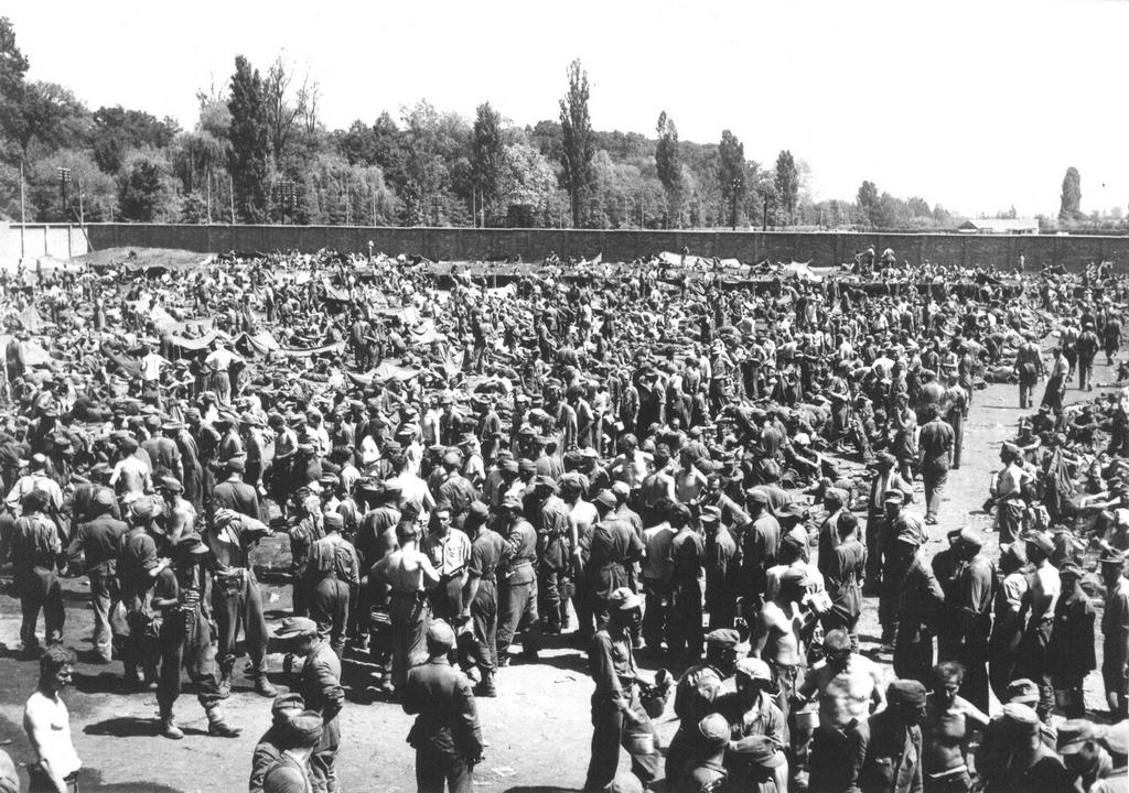 1945_a_britek_altal_hazaszallitott_jugoszlav_allampolgatok_akik_a_nemet_ea_olasz_hadseregben_harcoltak_varjak_sorsukat_egy_partizan_taborban.jpeg