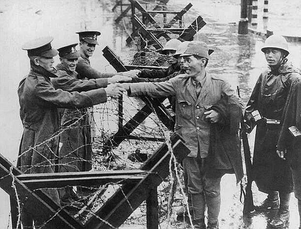1937_british_soldiers_congratulating_imperial_japanese_troops_on_their_recent_victory_over_the_chinese_kuomintang_shanghai_international_settlement_china.jpeg
