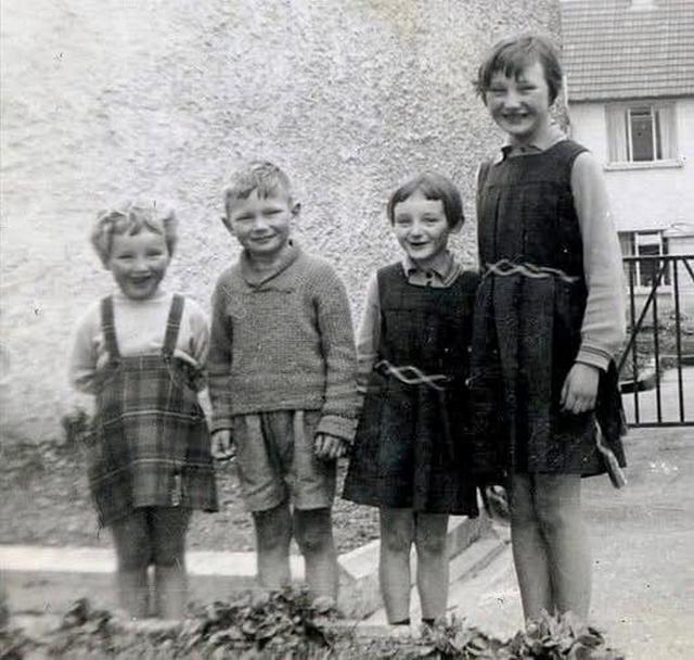 1960_a_young_liam_neeson_pictured_with_his_sisters_elizabeth_bernadette_and_rosaleen_in_1960_outside_their_family_home_in_ballymena_co_antrim_northern_ireland.jpeg