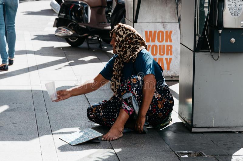 woman-beggar-asking-money-madrid-spain-september-unindentified-asked-busy-street-center-madrid-89503887.jpg