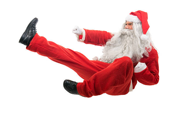 santa-claus-sitting-on-floor-mimicking-karate-moves-picture-id453308841.jpg