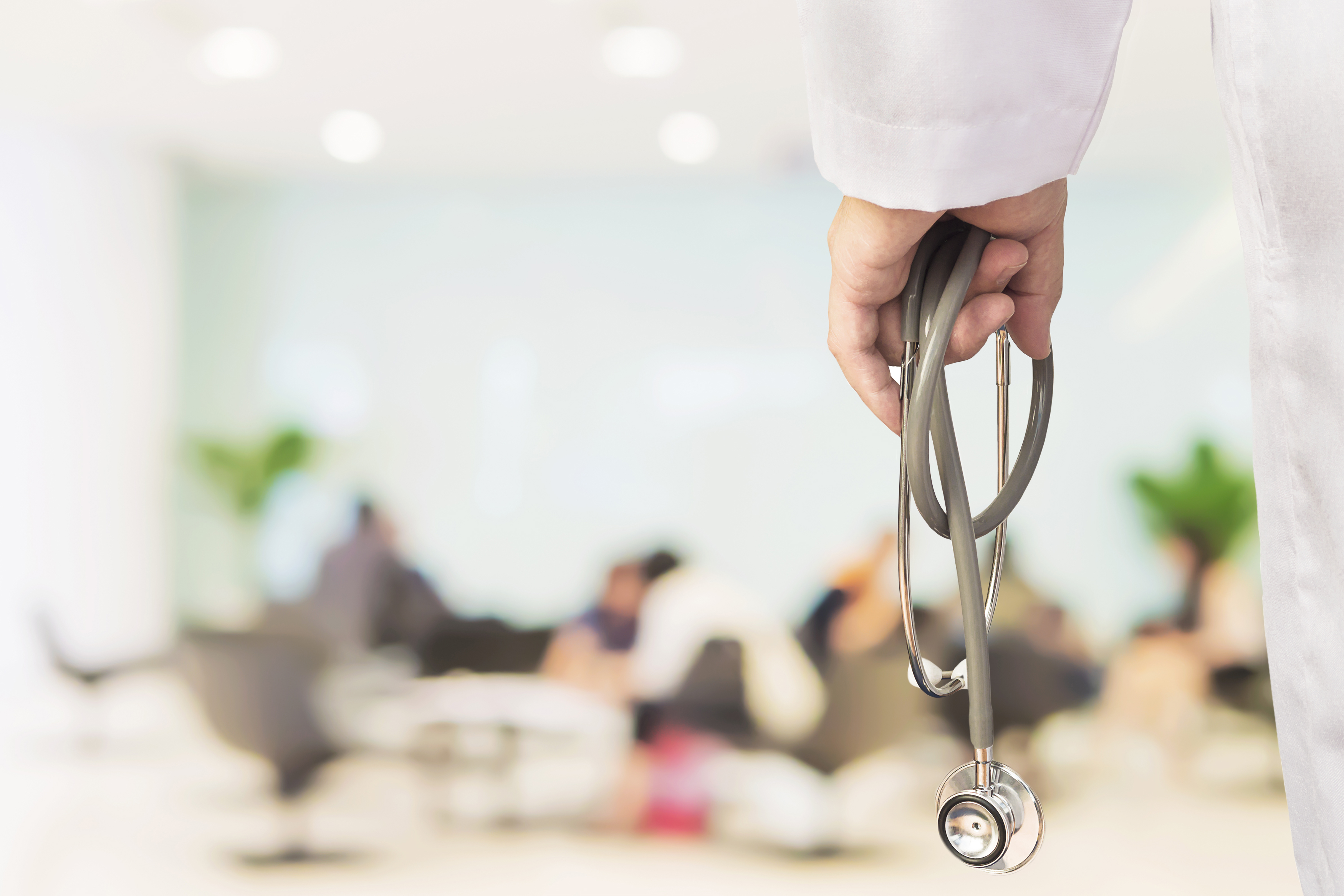 doctor-is-going-to-examine-his-patient-using-his-stethoscope-over-sitting-people.jpg