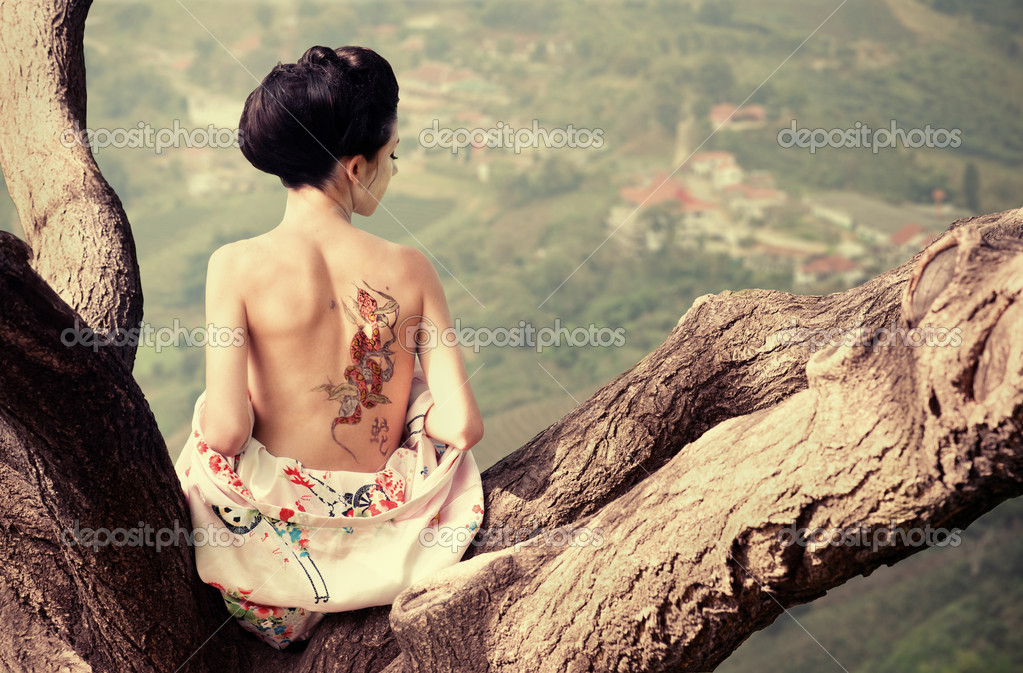 depositphotos_15870717-Woman-with-snake-tattoo-on-her-back-on-the-tree-branch.jpg