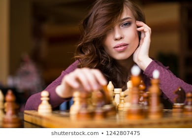 beautiful-brunette-woman-playing-chess-260nw-1242807475.jpg