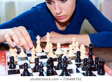 young-woman-makes-move-chess-260nw-716488792_masolata.jpg