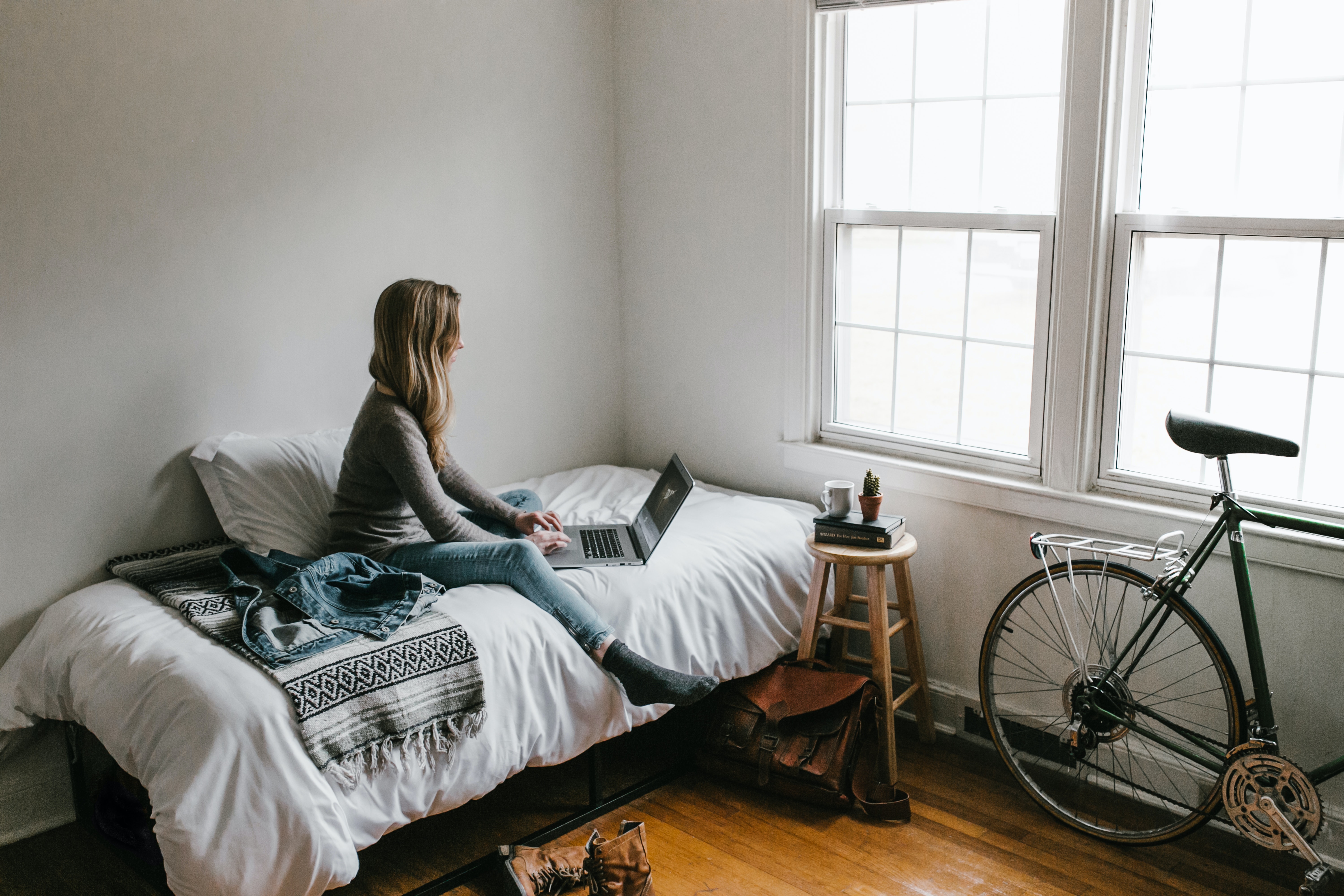 woman-in-gray-shirt-sitting-on-bed-3954635.jpg