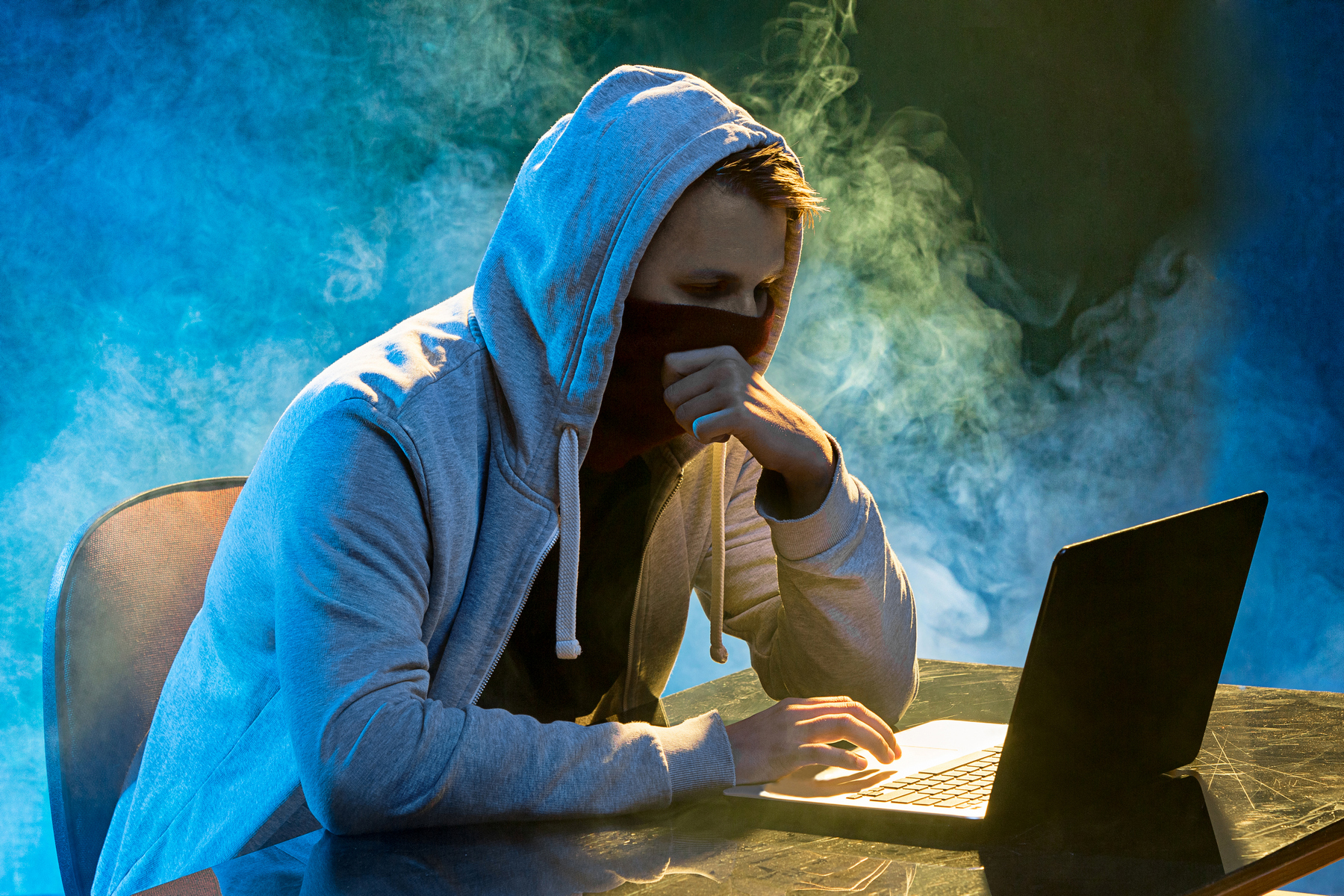 hooded-computer-hacker-stealing-information-with-p9u3l2p.JPG