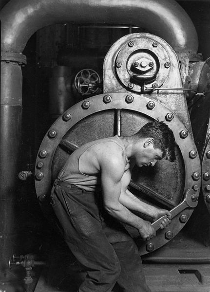 431px-Lewis_Hine_Power_house_mechanic_working_on_steam_pump.jpg