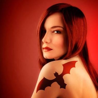 anna-omelchenko-photo-of-beautiful-sexy-girl-with-bat-tattoo-on-shoulder-isolated-on-red-background-halloween-holi_a-g-12260171-142583952.jpg